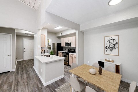 an open kitchen and dining room with a table