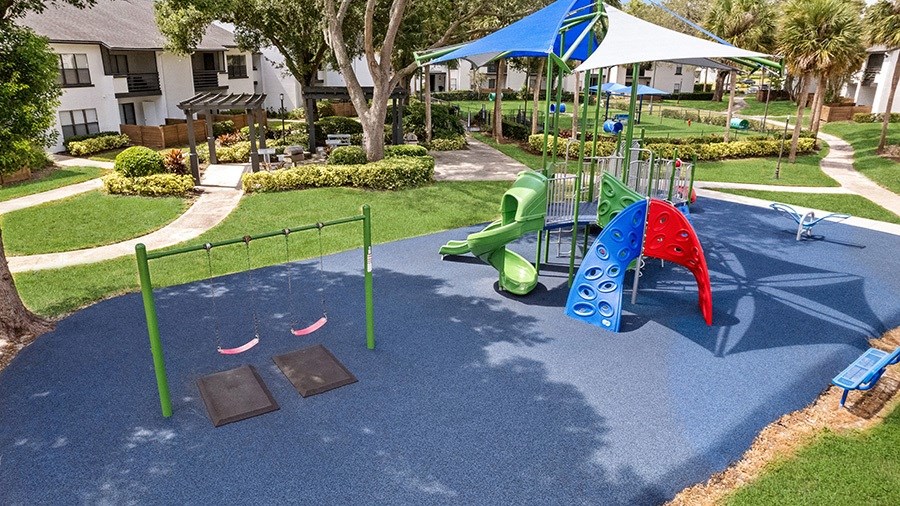 Aerial View of Community Playground and Swing Set at Rosehill Preserve Apartments in Orlando, FL.