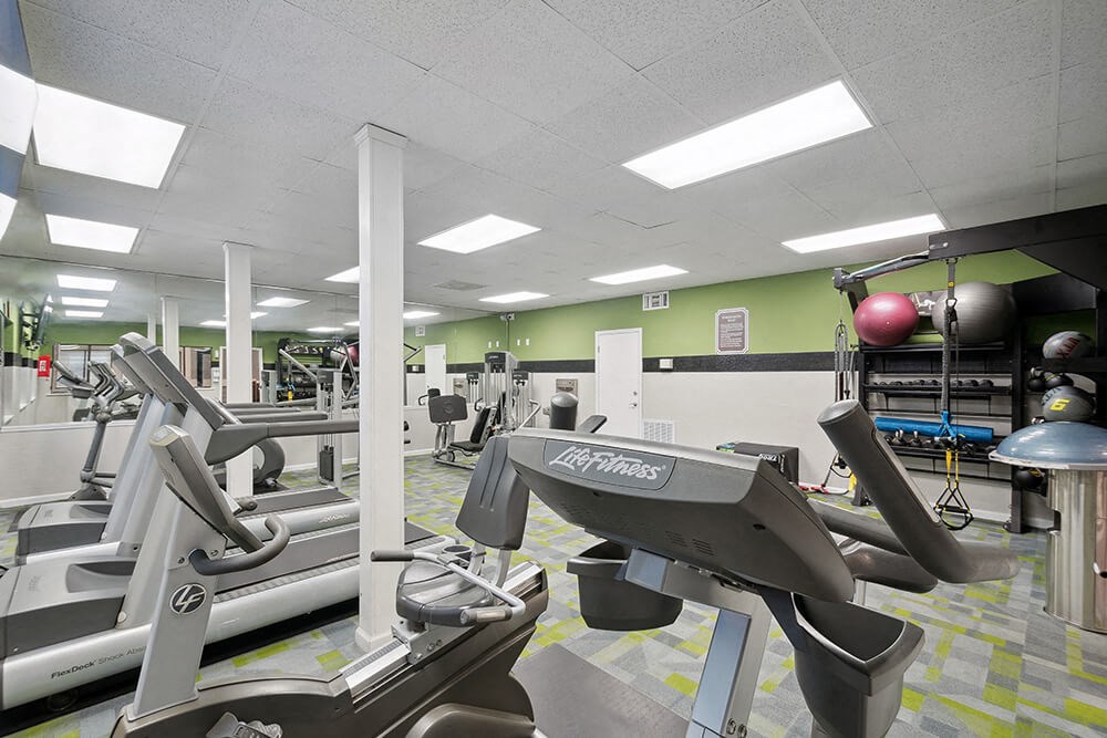 Community Fitness Center with Equipment at Westland Park Apartments in Jacksonville, FL.