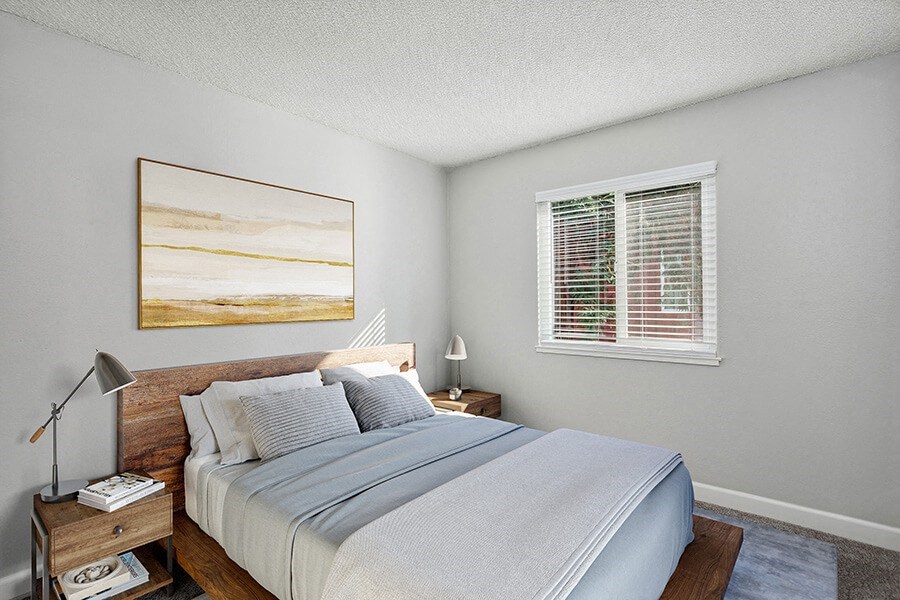 Model Bedroom with Carpet and Window View at The Archer Apartments in Sacramento, CA.