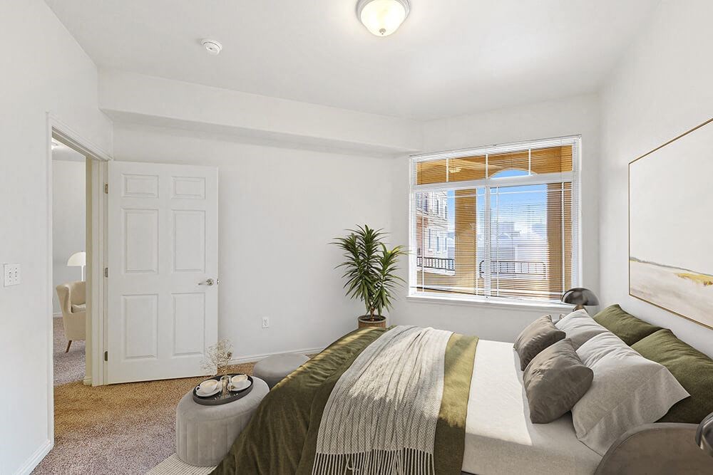 Model Bedroom with Carpet and Window View at Altitude on Fifth Apartments in Salt Lake City, UT.