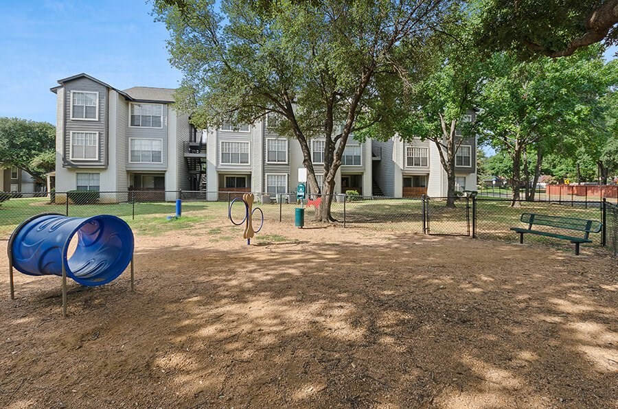 Community Dog Park with Agility Equipment at Cobblestone Apartments located in Arlington, TX.