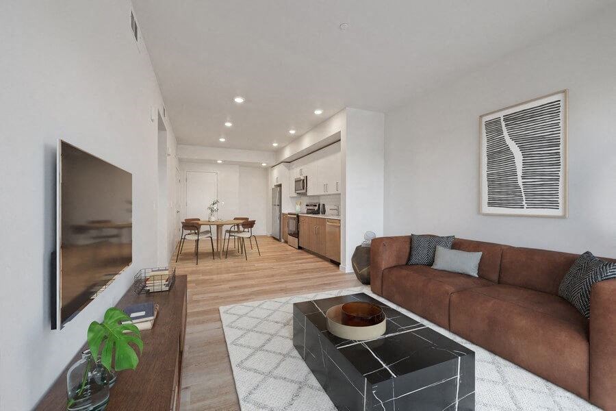 Model living room with view on kitchen and dining