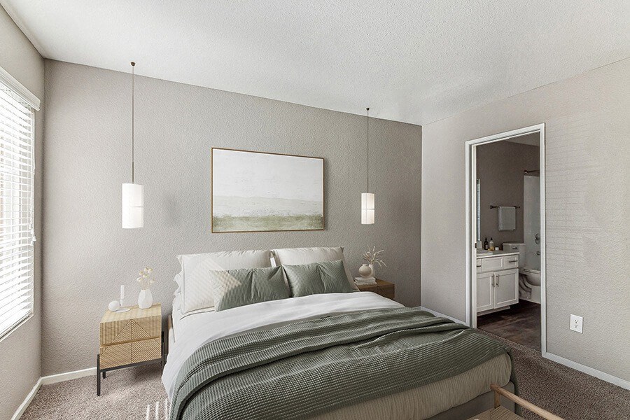 Model Bedroom with Carpet, Window View and attached Bathroom at Topaz Springs Apartments in Las Vegas, NV.
