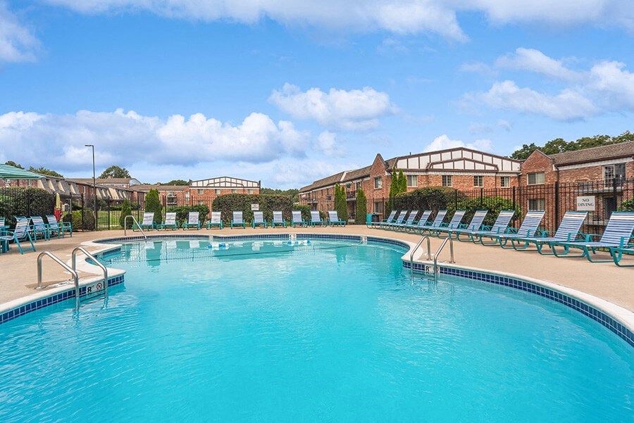 Community Swimming Pool with Pool Furniture at Heights Marlborough Apartments in Boston, MA.