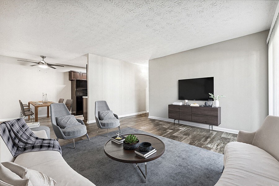 Model Living Room with Wood-Style Flooring at Paramont Apartments in Duluth, GA.