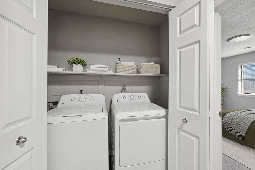Model Laundry Room with Washer and Dryer at Spring Forest Apartments in Raleigh, NC.