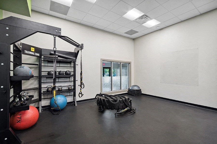 Community Fitness Center with Equipment at Rosehill Preserve Apartments in Orlando, FL.