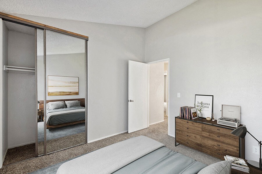 Model Bedroom with Carpet and Closet at Bridges on Sunset Apartments in Suisun City, CA.