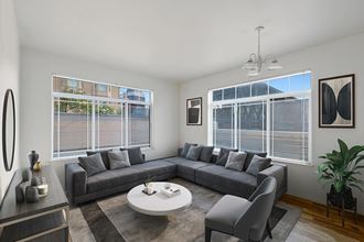 Model Living Room with Wood-Style Flooring and Window View at Altitude on Fifth Apartments in Salt Lake City, UT.