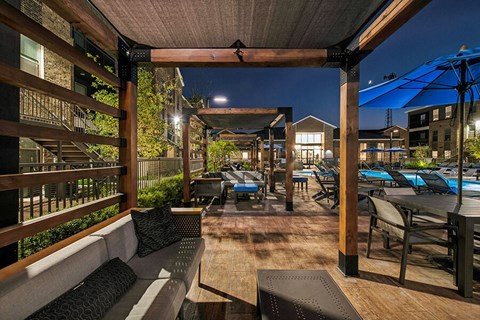 Outdoor Patio with Lounge Furniture at Alta 3Eighty Apartments located in Aubrey, TX.