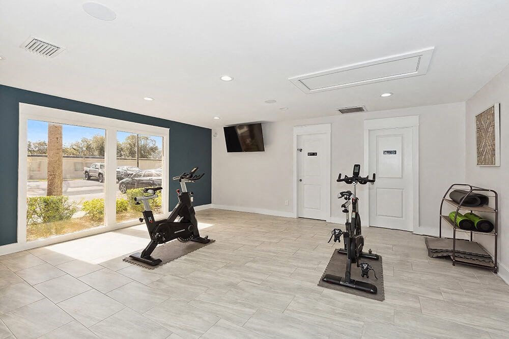 Community Fitness Center with Equipment at Seven Lakes at Carrollwood Apartments in Tampa, FL.