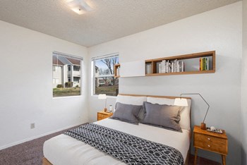 Model bedroom showcasing multiple windows