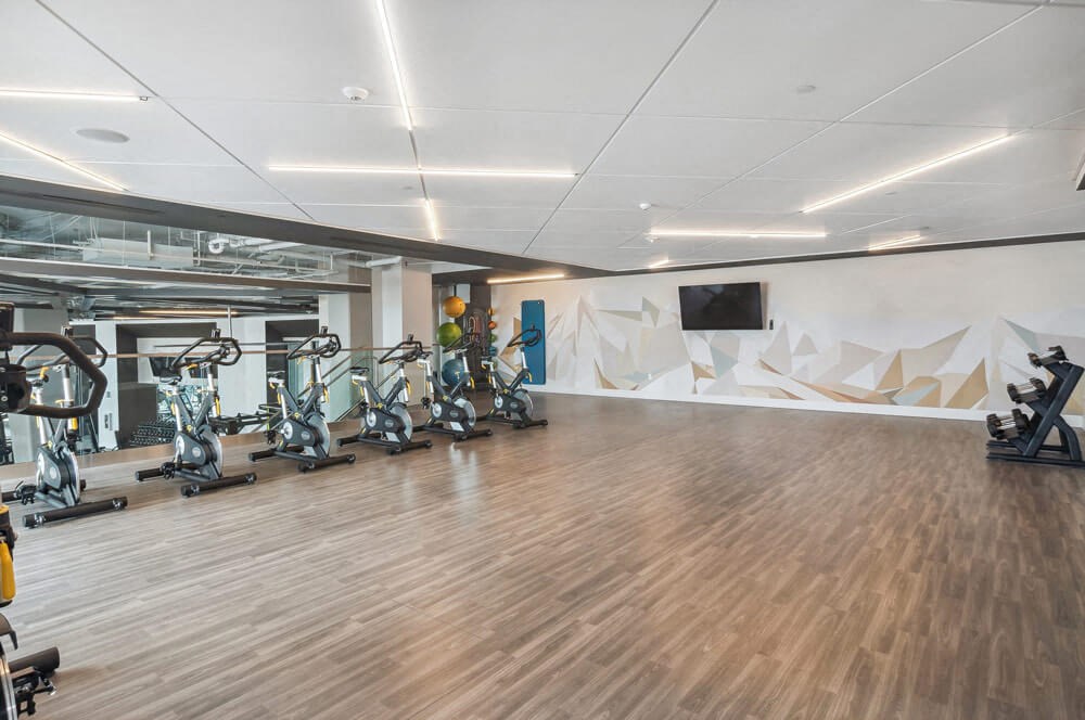 Large open gym area loaded with top of the line fitness equipment at Post District Residences in Downtown Salt Lake City, Utah