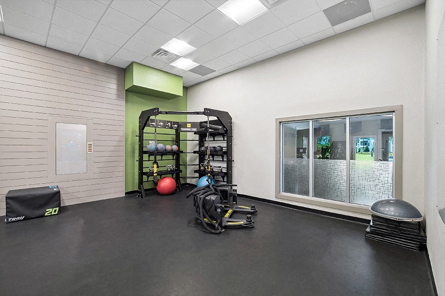 Community Fitness Center with Equipment at Rosehill Preserve Apartments in Orlando, FL.