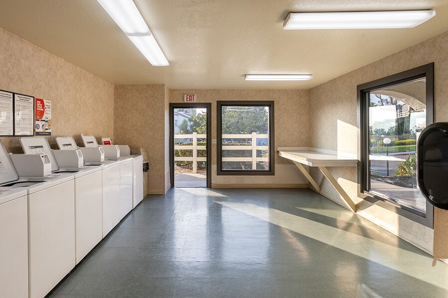 Community Laundry Center at Santa Fe Ranch Apartments located in Carlsbad, CA.