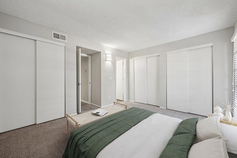 Model Bedroom with Carpet and Window View at Country Club Verandas Apartments located in Mesa, AZ.