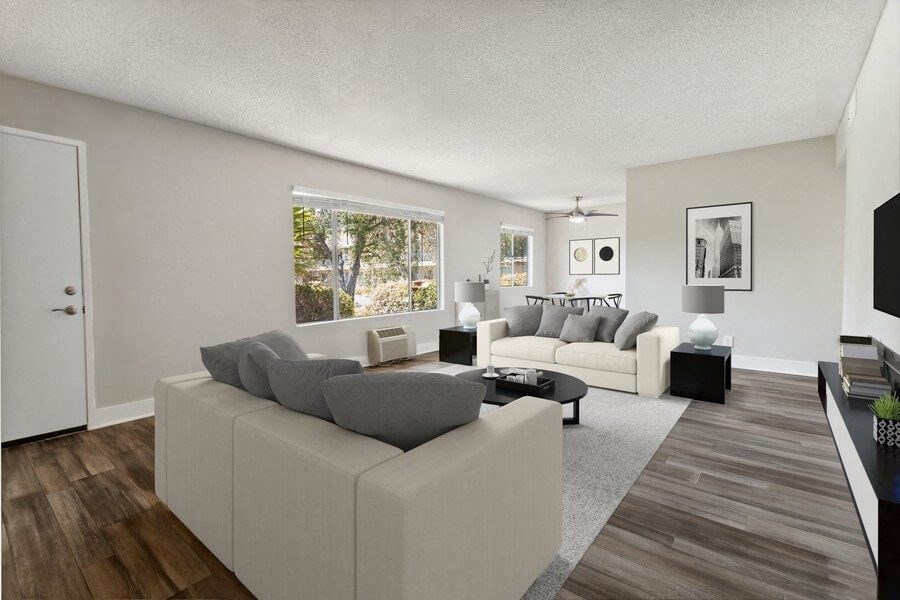 Model Living Room with Wood-Style Flooring & Window View at Forest Park Apartments in El Cajon, CA.