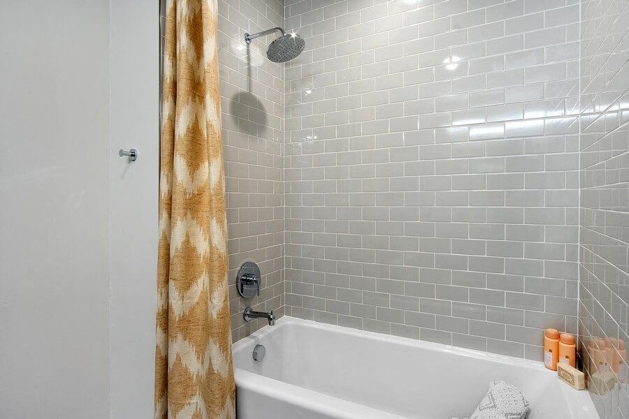 Model bathroom with tiled bathtub
