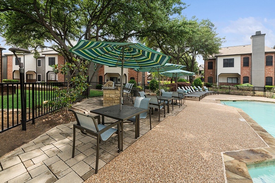 Community Swimming Pool and Grill Area at Dallas North Park Apartments in Dallas, TX.