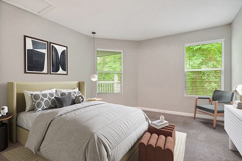 Model Bedroom with Carpet and Window View at Park 2300 Apartments in Charlotte, NC.