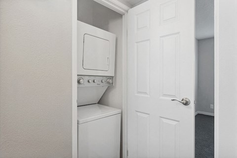 Model Unit Stackable Washer and Dryer Hook Up at Overlook Point Apartments in Salt Lake City, UT.
