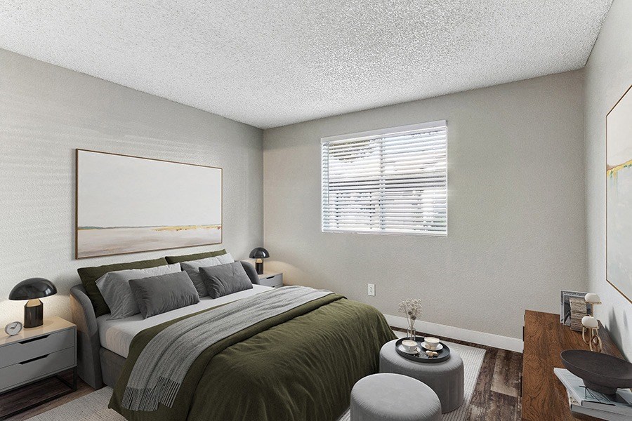 Model Bedroom with Wood-Style Flooring at Meadow Ridge Apartments in Las Vegas, NV.