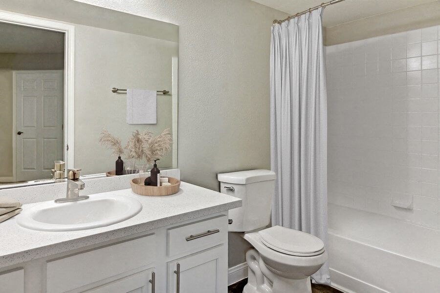 Model bathroom with a sink toilet and shower