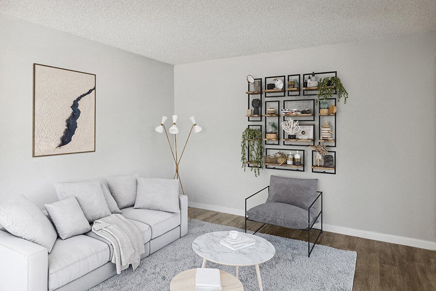 Model Living Room with Wood-Style Flooring at Hilands Apartments in Tucson, AZ.