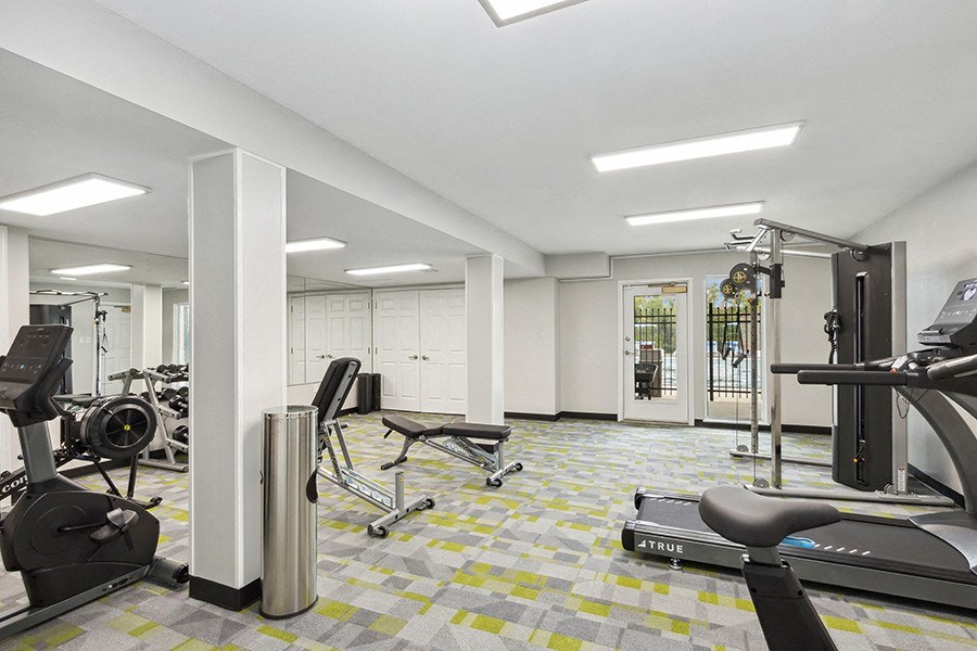 Community Fitness Center with Equipment at Parc at Creekside Apartments in Kansas City, MO.