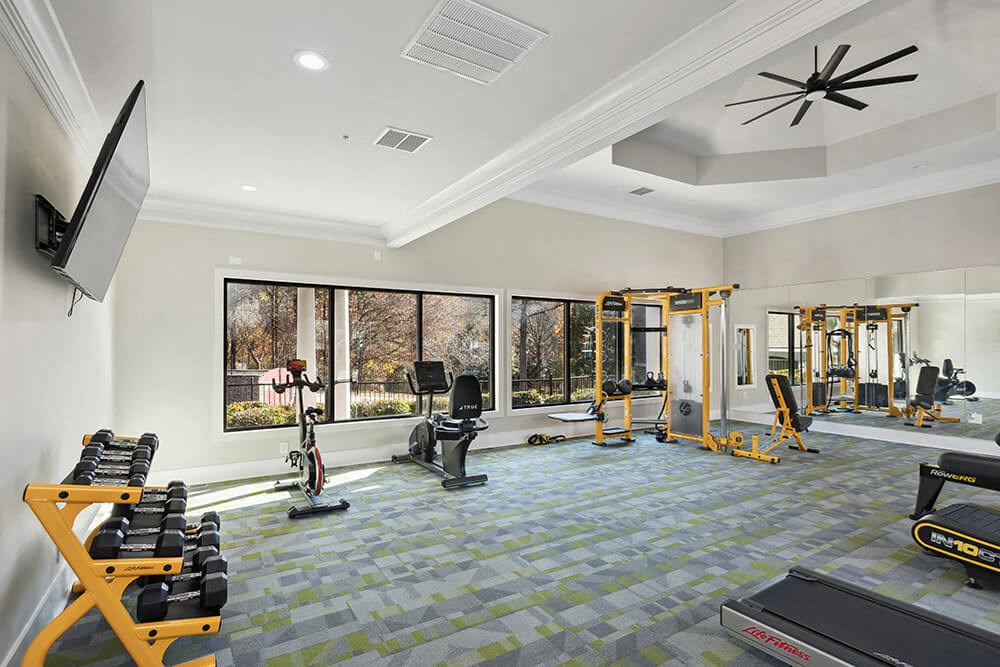 Community Fitness Center with Equipment at Shadow Ridge Apartments in Riverdale, GA.