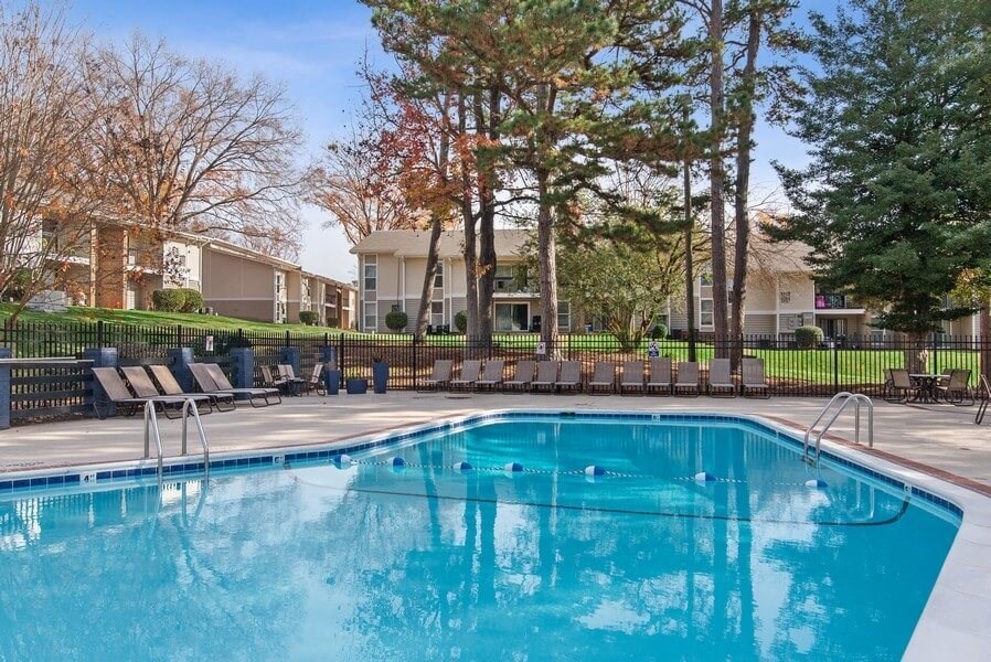 Swimming pool surrounded by lounge chairs