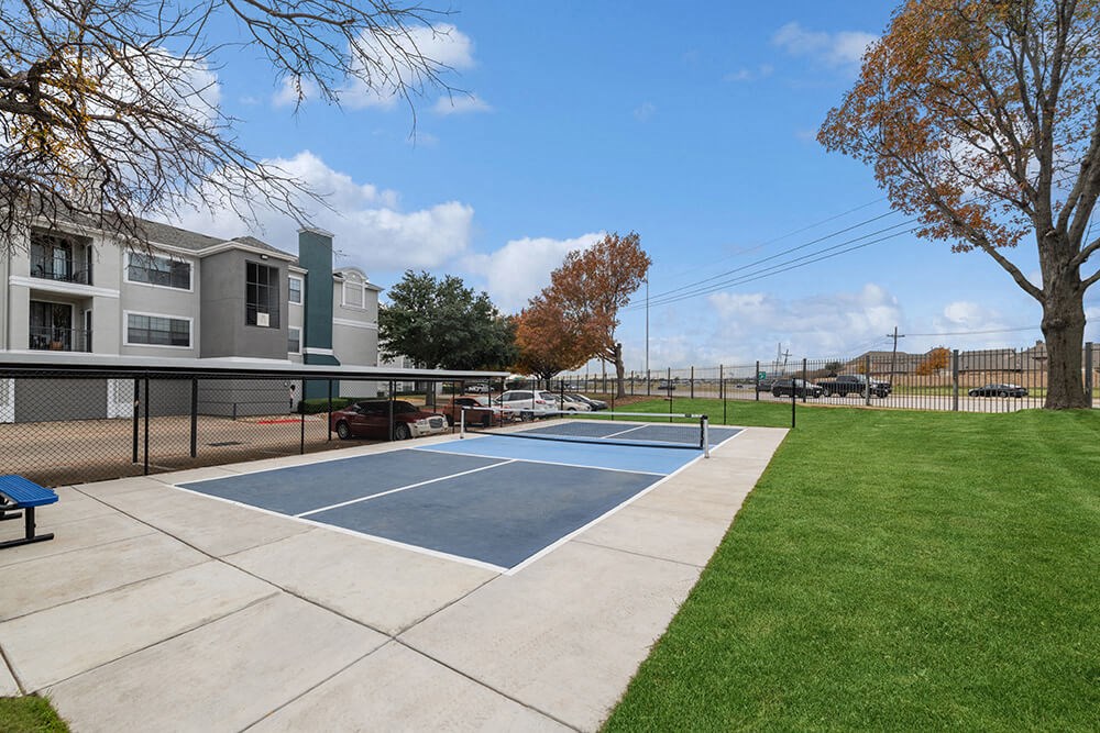Community Sports Court with Nets at Bridges at Oakbend Apartments in Lewisville, TX.