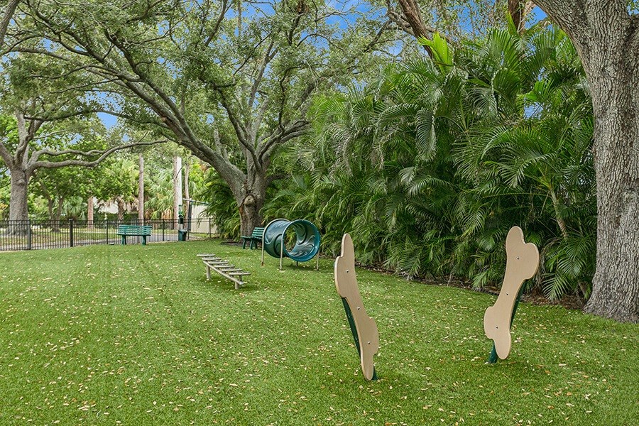 Community Dog Park with Agility Equipment at Huntington Place Apartments located in Sarasota, FL.