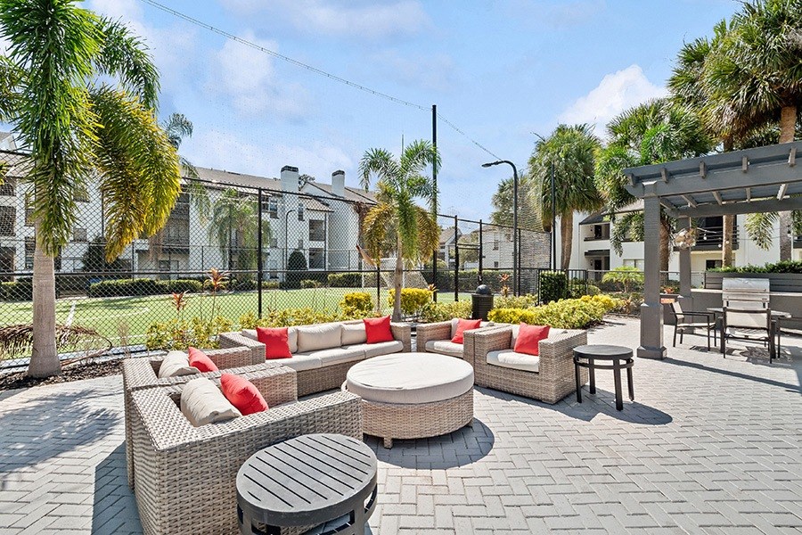 Outdoor Lounge Area with Furniture at Rosehill Preserve Apartments in Orlando, FL.