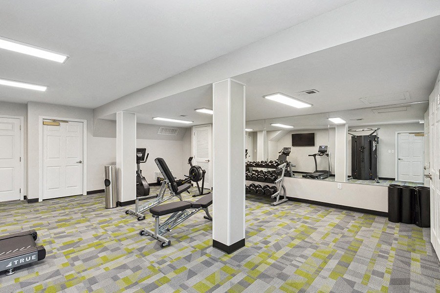 Community Fitness Center with Equipment at Parc at Creekside Apartments in Kansas City, MO.