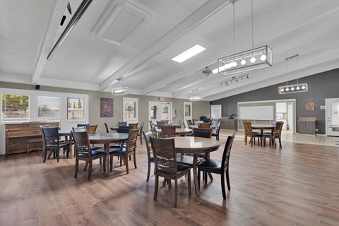 A dining room with a table set for six.