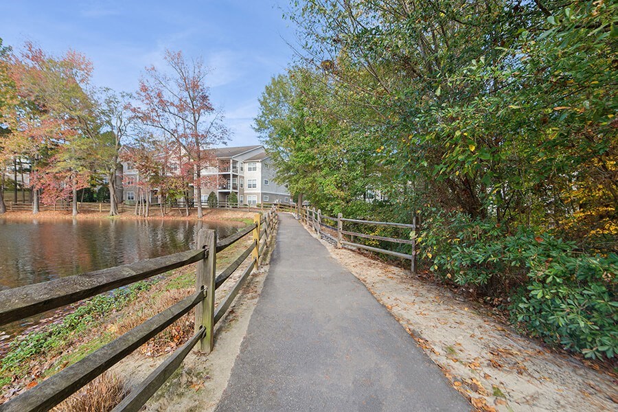Community Walking Path and Lake at Lake Cameron Apartments located in Apex, NC.