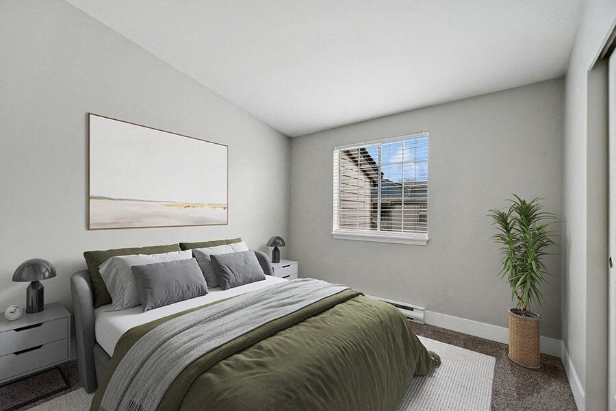 Model Bedroom with Carpet and Window View at Central Flats Apartments in Kent, WA.