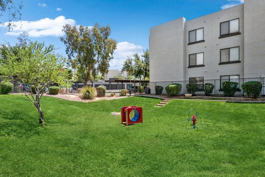Community Dog Park with Agility Equipment at Harmony at Surprise Apartments in Surprise, AZ.