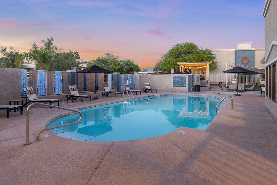 Community Swimming Pool with Pool Furniture at Ridgeline Apartments in Tucson, AZ.