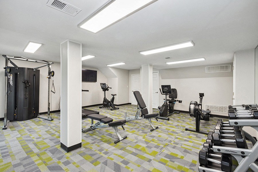 Community Fitness Center with Equipment at Parc at Creekside Apartments in Kansas City, MO.