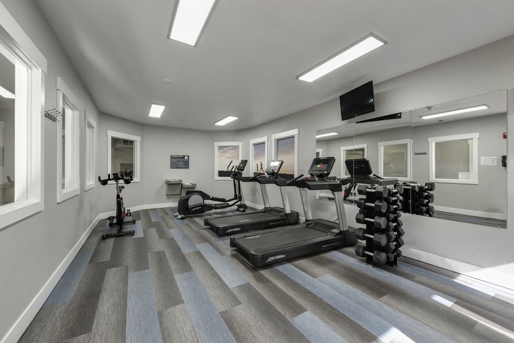 Community Fitness Center with Equipment at Landings at Morrison Apartments located in Gresham, OR.