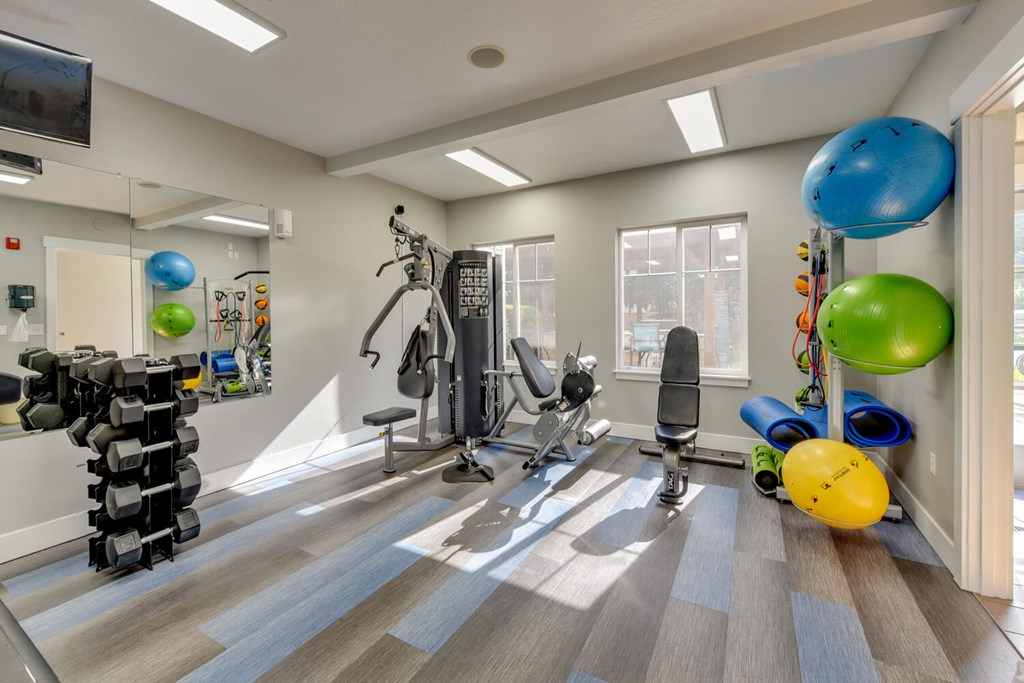 Community Fitness Center with Equipment at Landings at Morrison Apartments located in Gresham, OR.