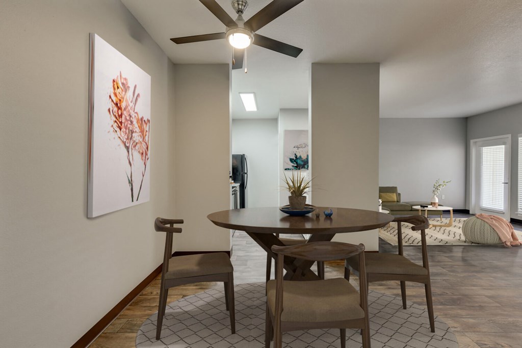 Model Dining Room with Wood-Style Flooring at Landings at Morrison Apartments located in Gresham, OR.
