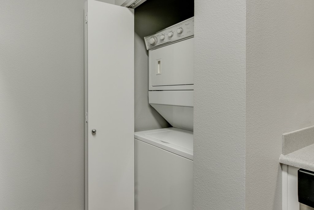 Model Laundry Room with Washer & Dryer at Landings at Morrison Apartments located in Gresham, OR.