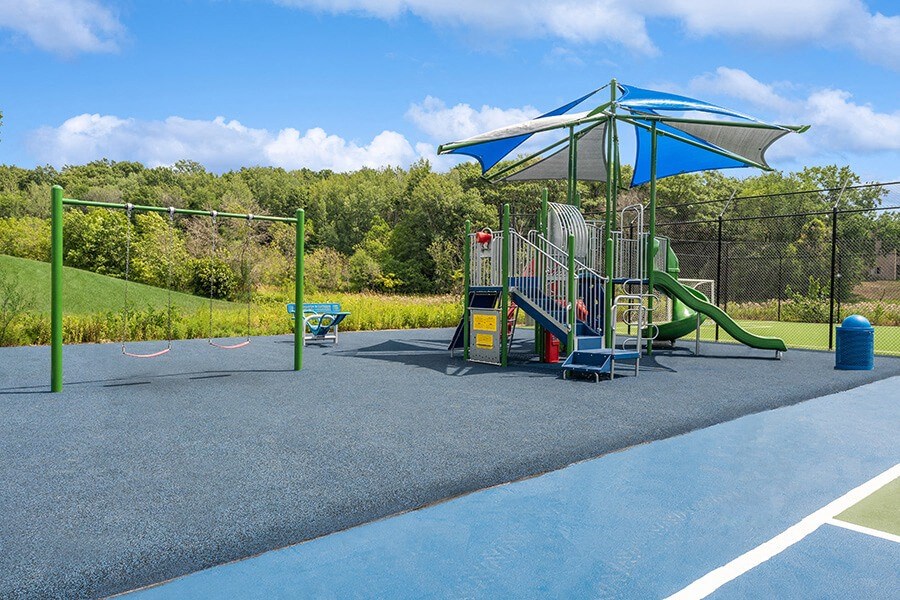 Community Playground with a Slide, Swing Set and Canopy at Elevate on Parkway Apartments, Minnesota