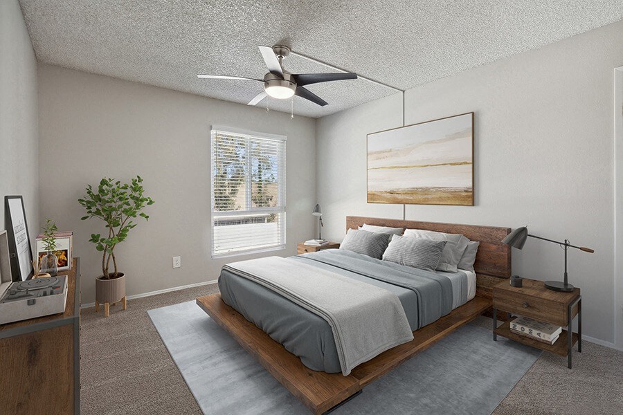 Model Bedroom with Carpet and Window View at Colonnade at Fletcher Hills Apartments in El Cajon, CA.