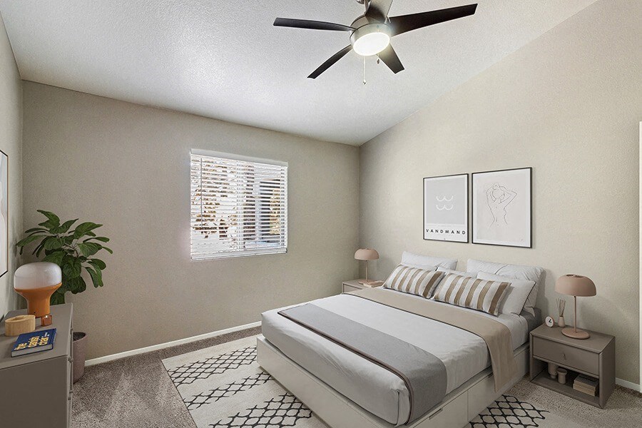 Model Bedroom with Carpet and Window View at Verraso Apartments in Las Vegas, NV.