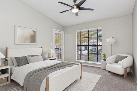 Model Bedroom with Carpet and Window View at Grand Pavilion Apartments in Tampa, FL.